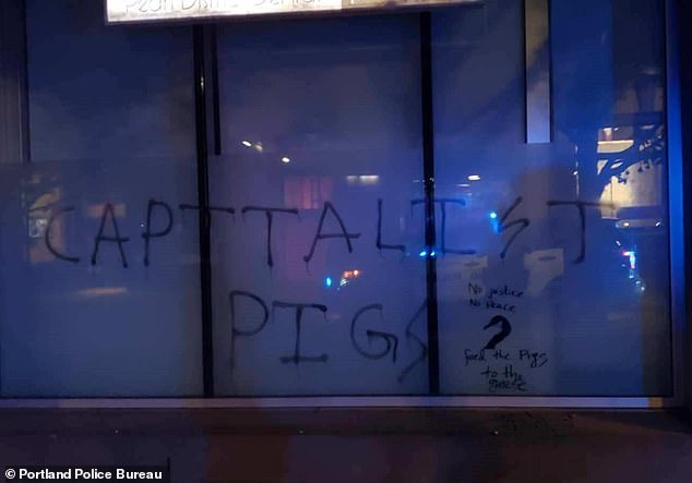 Walls were daubed with graffiti by some members of the protest group, prompting police to declare the gathering a riot and move in