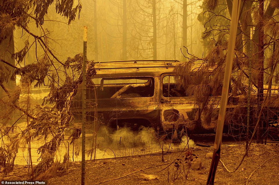 A scorched car rests in a clearing following the Bear Fire in Butte County, California, on Wednesday