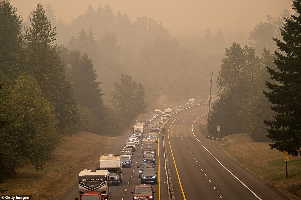 Oregon residents evacuate north along highway Highway 213 on Wednesday near Oregon City, Oregon. As of Thursday night, more than 500,000 Oregonians - 10 per cent of the state's population - have been forced to evacuate