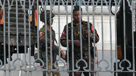 Soldiers keep watch inside the City Hall compound in Yangon on February 1, 2021.