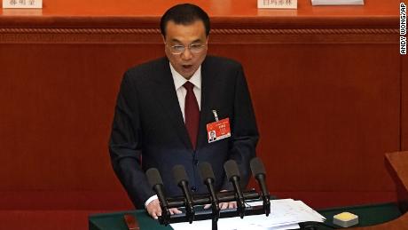 Chinese Premier Li Keqiang delivers a speech during the opening session of China's National People's Congress at the Great Hall of the People in Beijing on Friday.
