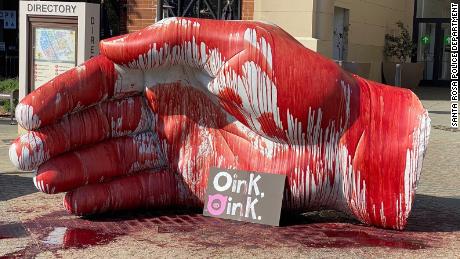 Pig's blood covers a statue at Santa Rosa Plaza Mall on Saturday, April 17, 2021.