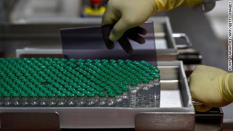 Vials of Covishield, AstraZeneca-Oxford's Covid-19 coronavirus vaccine are pictured inside a lab where they are being manufactured at India's Serum Institute in Pune on January 22, 2021.