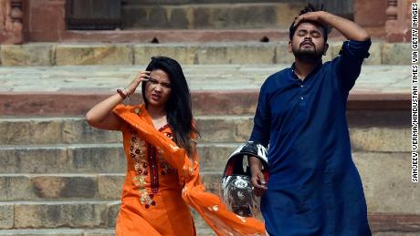 Visitors at Humayun's Tomb in New Delhi, India, on a hot day on June 30 amid a heatwave.