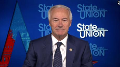 Arkansas' governor defends decision to approve a statewide ban on mask mandates