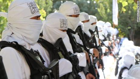 The Taliban have published a series of photographs of their fighters at an Independence Day parade brandishing US assault weapons.