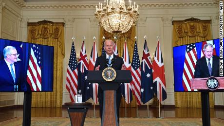 US President Joe Biden speaks on national security with British Prime Minister Boris Johnson, right, and Australian Prime Minister Scott Morrison, left, in East Room of the White House in Washington, DC, on September 15.