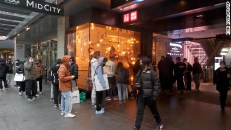 Customers line up to enter a store in Sydney on October 11 after more than 100 days of lockdown.
