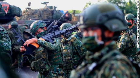 Taiwanese soldiers prepare grenade launchers, machine guns and tanks in a drill preparing for a Chinese invasion in Tainan, Taiwan, on September 16, 2021.