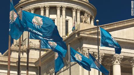 The state flag flies at the Oklahoma State Capitol in Oklahoma City in 2018.