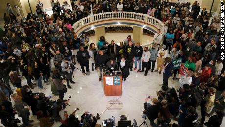 Madeline Davis-Jones and other family members and friends talk to reporters Wednesday at the Capitol in Oklahoma City