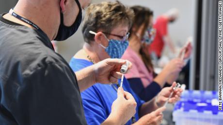 All vaccinated adults should get a Covid-19 booster because of Omicron, CDC says