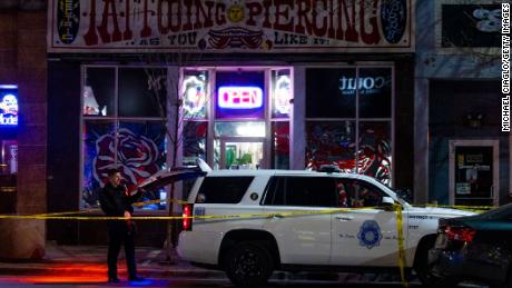 Police officers work at a scene where two women were killed and a man was injured in a shooting on December 27, 2021 in Denver, Colorado.