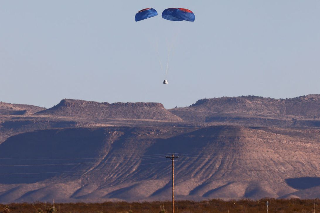 Blue Origin's New Shepard crew capsule descends on the end of its parachute system carrying Good Morning America co-anchor Michael Strahan, Laura Shepard Churchley, daughter of astronaut Alan Shepard, and four other civilians on December 11, 2021, near Van Horn, Texas.