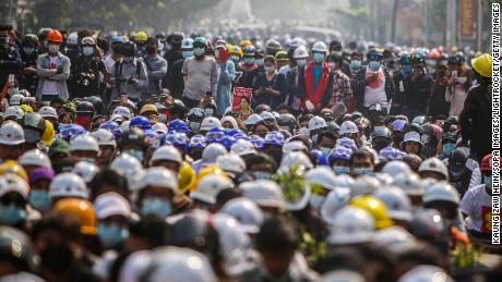 A crowd of protesters listens to speeches during an anti-military coup demonstration in Mandalay on March 7, 2021.