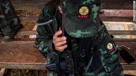 Members of the Karenni Nationalities Defense Force (KNDF) at a checkpoint near Demoso, in Myanmar's eastern Kayah state on October 19, 2021.