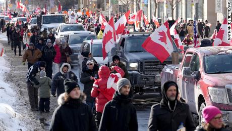 Trucks and supporters travel down Bloor Street during a demonstration in support of a trucker convoy in Ottawa on Saturday, February 5, 2022.