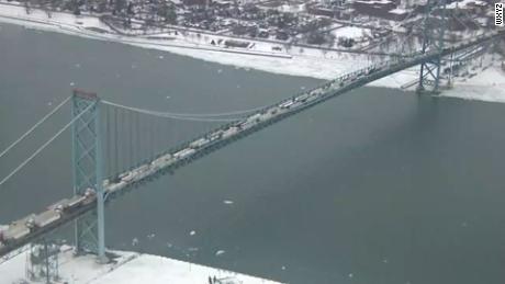 Canadian protesters block the busiest international crossing in North America as tensions ramp up over Covid-19 rules