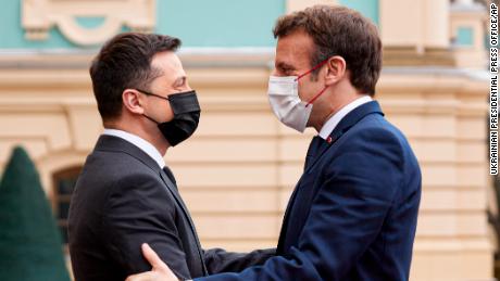 Diplomatic efforts to defuse the tensions around Ukraine continued on Tuesday with Emmanuel Macron, right, arriving in Kyiv for talks with Ukraine's president.