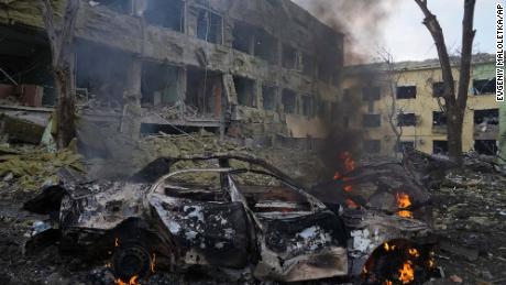 A car burns at the side of the maternity hospital on Wednesday.