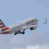 A flight was diverted after a passenger tried to open the plane door