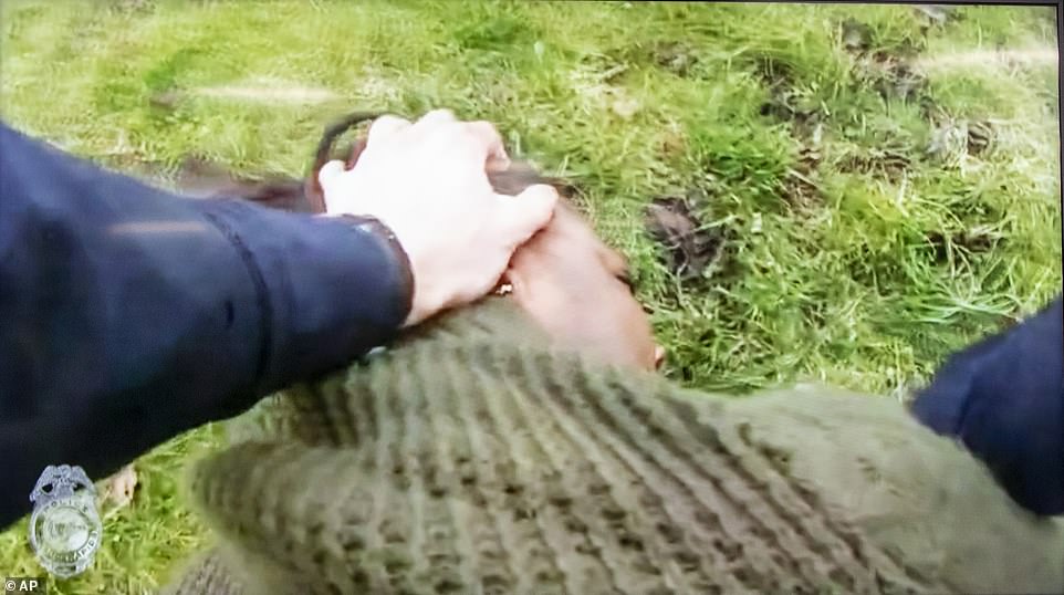 Lyoya is seen on video on the ground during the scuffle with the Michigan cop just before he's shot