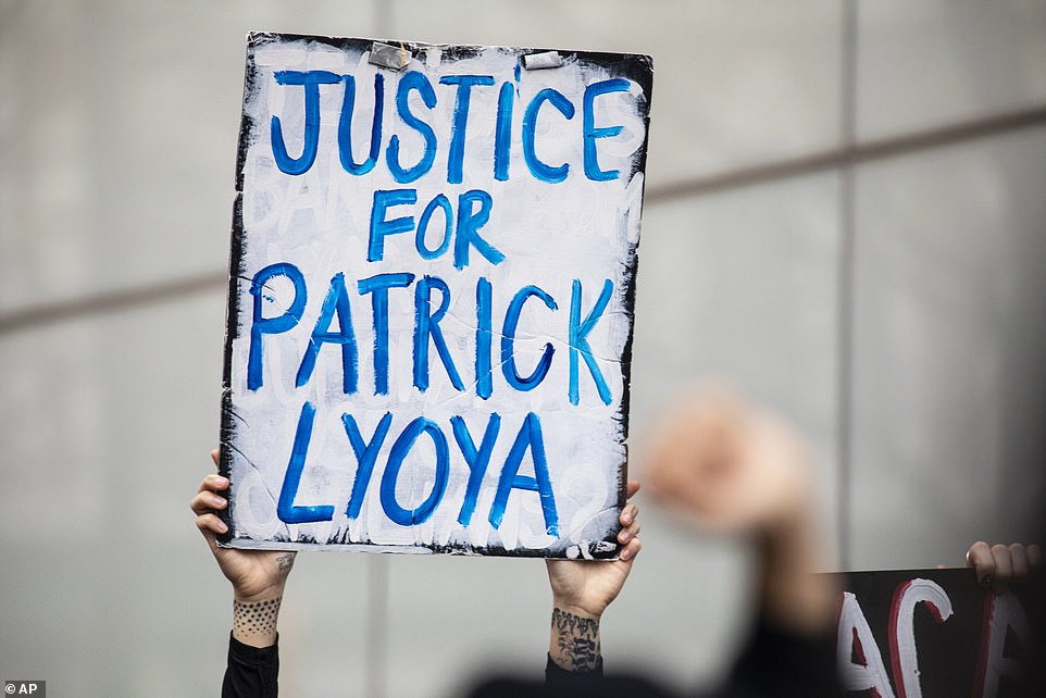The group demanded that officials make public the name of the officer in the shooting
