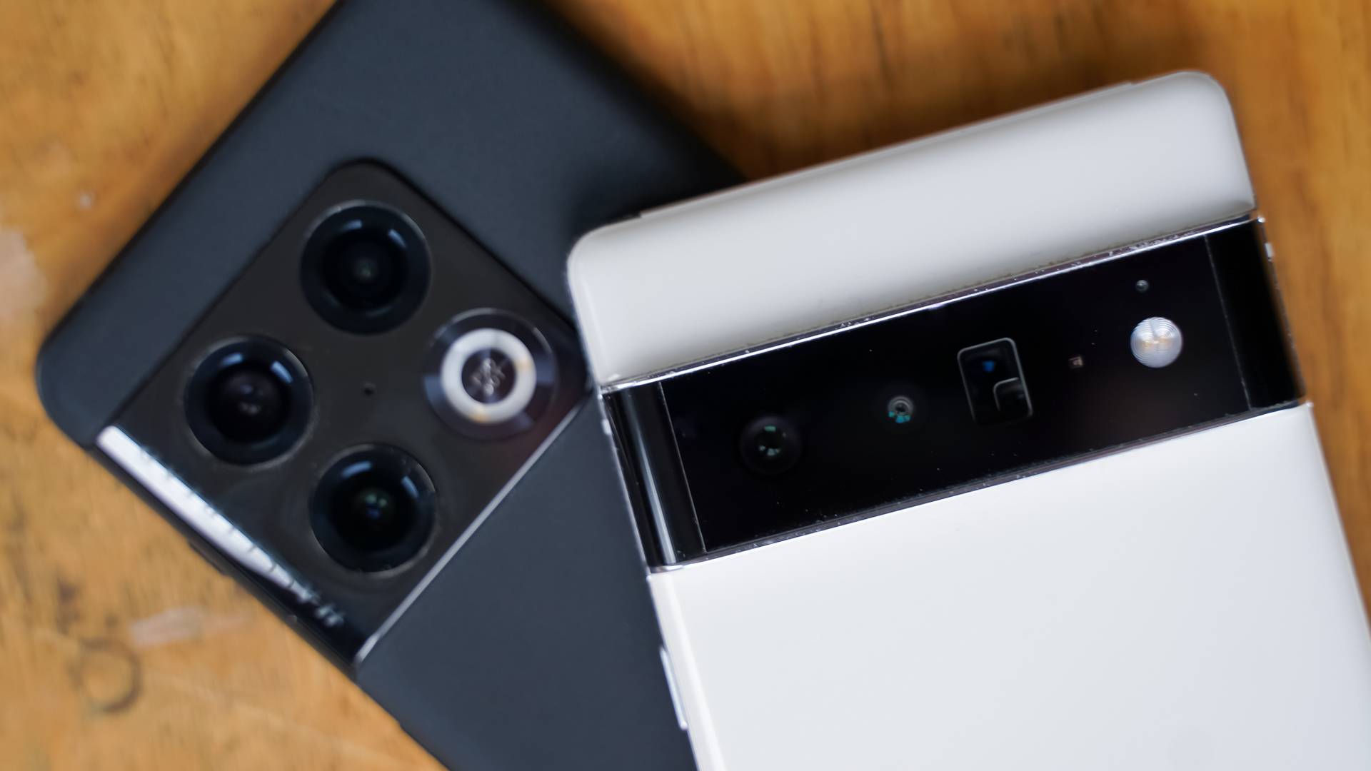 OnePlus 10 Pro vs Google Pixel 6 Pro cameras on desk OnePlus 10 Pro vs Google Pixel 6 Pro cameras on desk