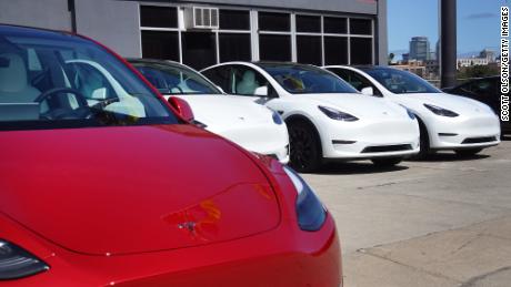Tesla cars sit in a dealership lot on March 28, 2022 in Chicago, Illinois.