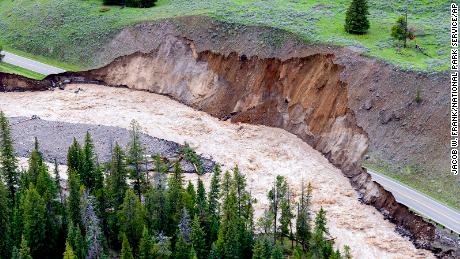 A road near Yellowstone National Park's northern entrance was significantly damaged by flooding.