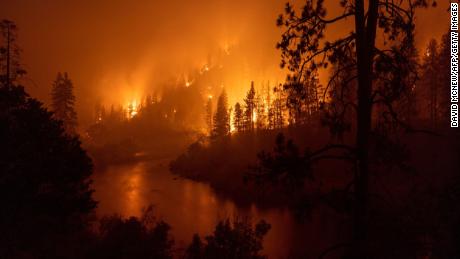 Two ultra-rare floods in a single week; a wildfire generating its own weather. Here's how it's connected
