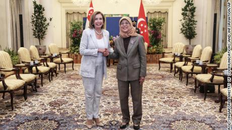 US House Speaker Nancy Pelosi, left, and Singapore President Halimah Yacob shake hands at the Istana Presidential Palace in Singapore, Monday, Aug. 1.