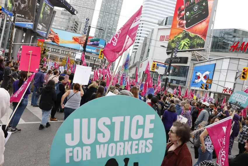 People gathered at the intersection of Yonge St. and Dundas St. in Toronto to rally in support of education workers on Nov. 5. CUPE education support workers began striking yesterday across the province.