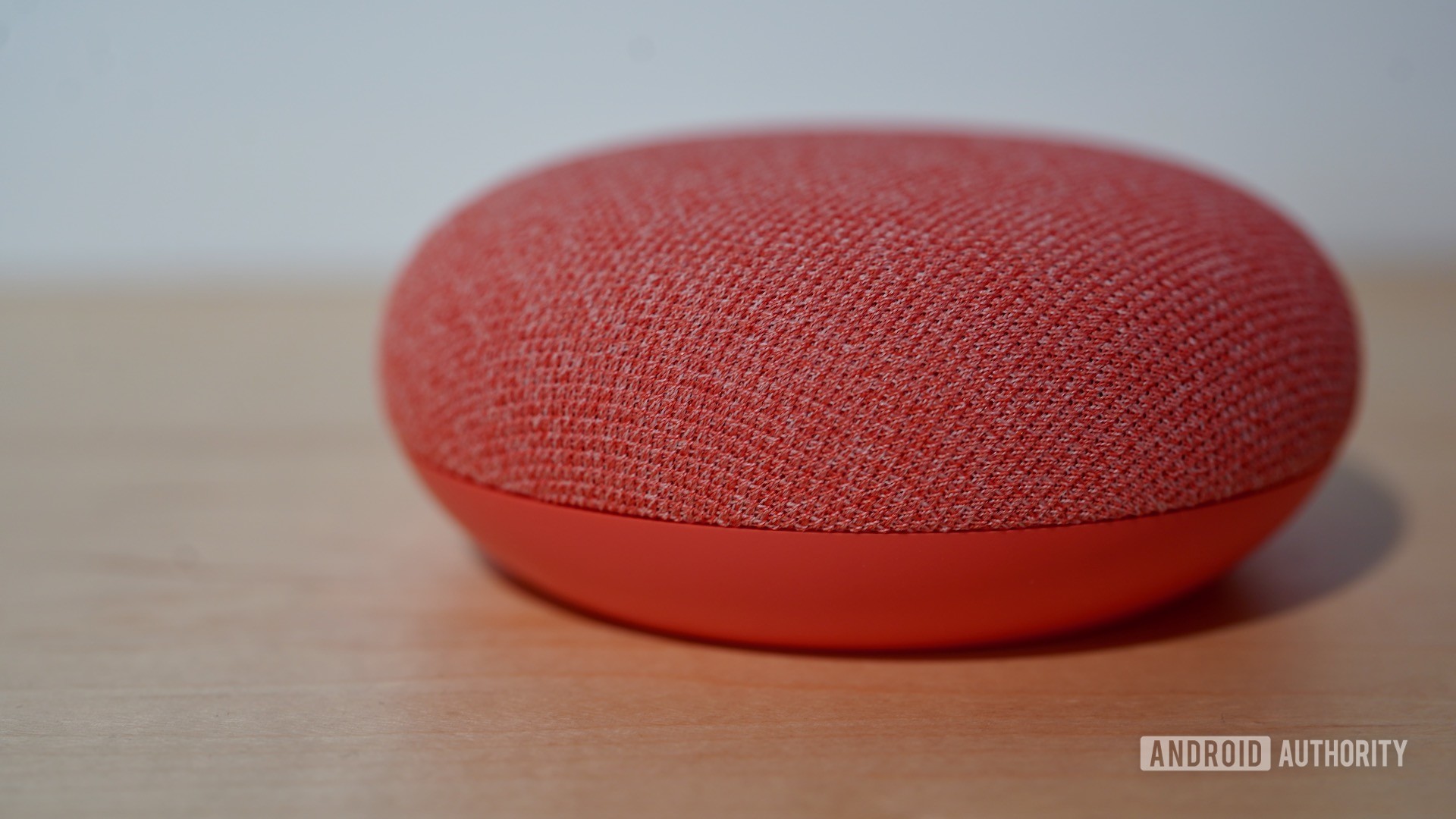 Google Nest Mini coral A Google Nest Mini in coral