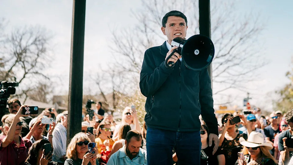 James Talarico speaks at a campaign event with bullhorn