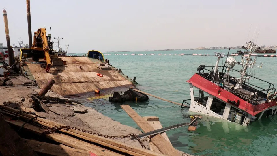 A sunken vessel is seen at the surface of the water in the port of Mocha the day after an attack by the Houthis on August 9, 2026. Strikes by the Iran-backed Houthi rebels have been happening on Yemen's west coast for weeks. - Khaled Ziad/AFP/Getty Images