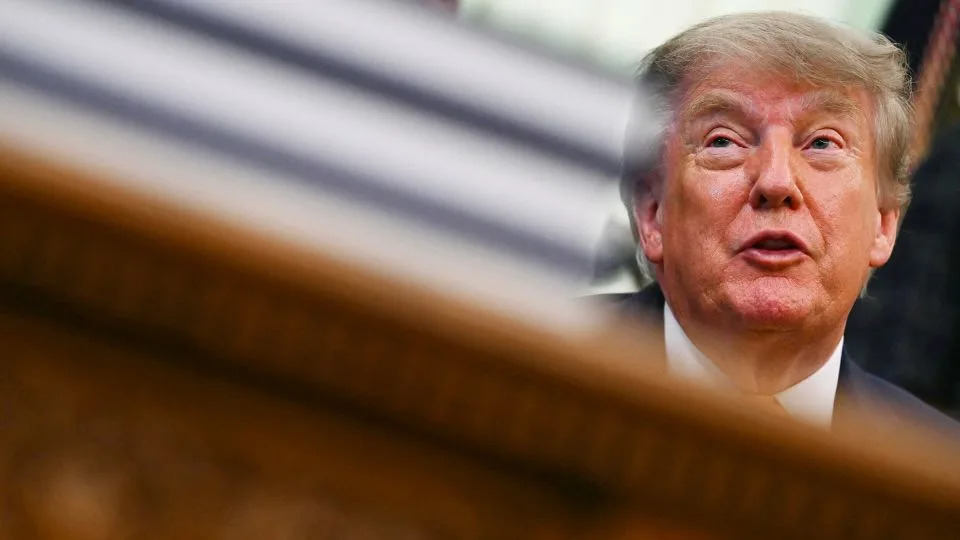 President Donald Trump speaks before signing executive orders in the Oval Office on Friday. - Kent Nishimura/AFP/Getty Images