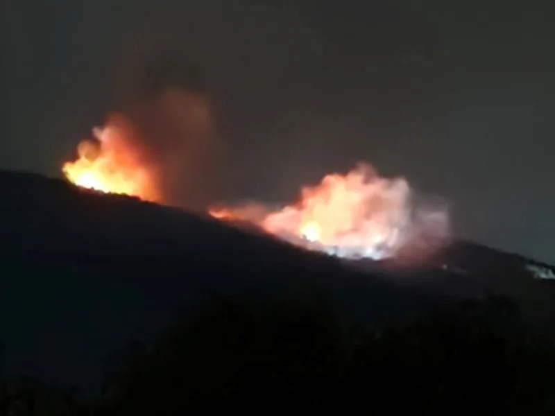 Fire and smoke rise near an ammunition warehouse, near the village of Tsareva Livada