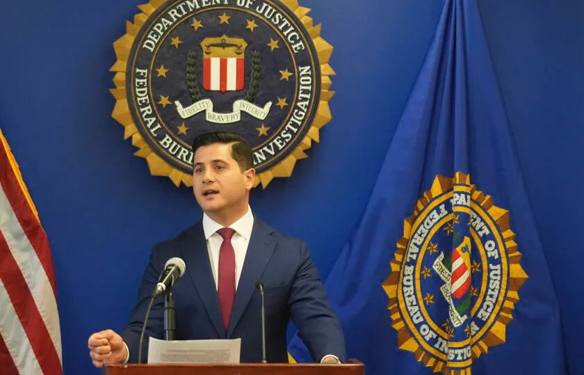 A man speaks into a microphone.