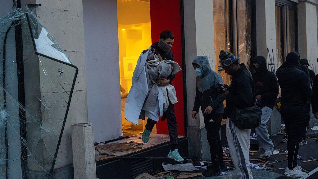 A shop is looted during demonstrations on October 17, 2026 in Paris, France.