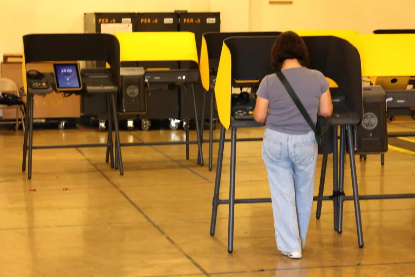A voter casts her ballot in Boyle Heights on Saturday, the first day of early voting in Los Angeles.
